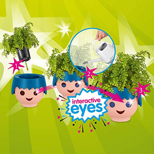 Macetero OJO Ocean Blue con diseño de cabeza de muñeco Playmobil con secuencia de OJOs con cambio de color para control de riego con plantas sobre fondo verde