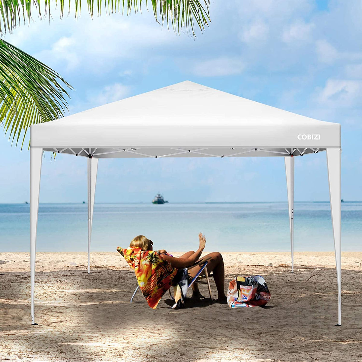 Vista en la playa de la Carpa cenador3x3m Plegable Impermeable 4 Paredes, Protección UV 50+, Ajustable en Altura. Modelo en color azul. COBIZI